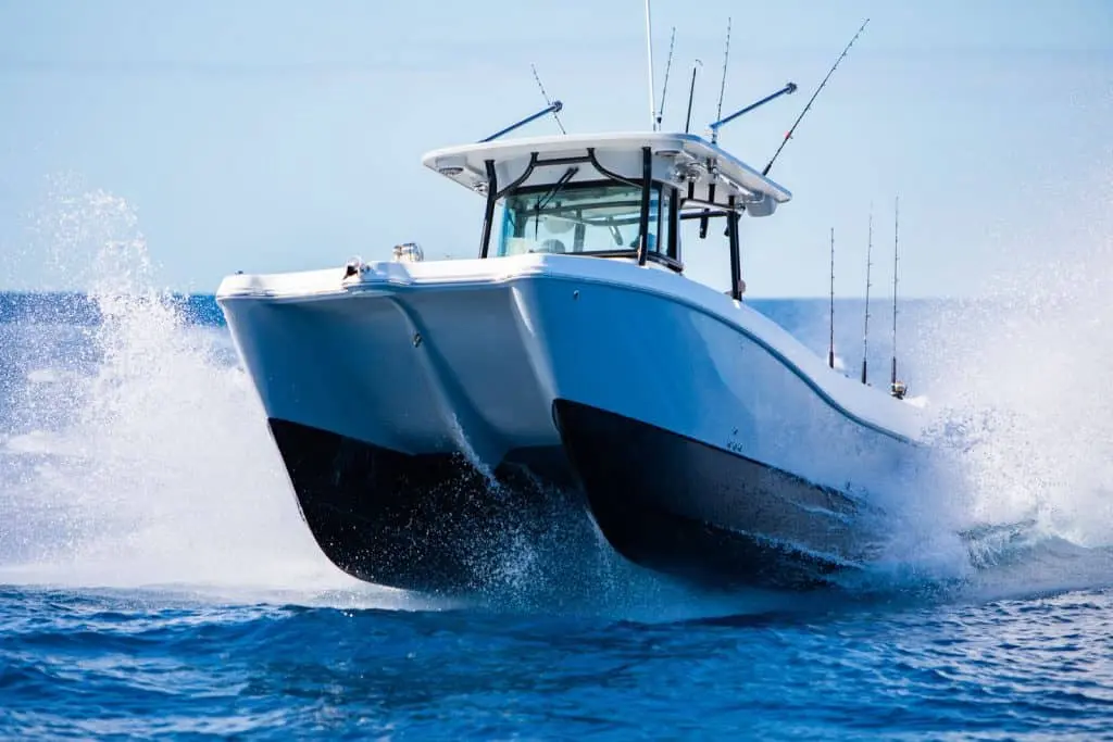 Anglers battling fish on a World Cat 325CC in the Arabian Gulf 